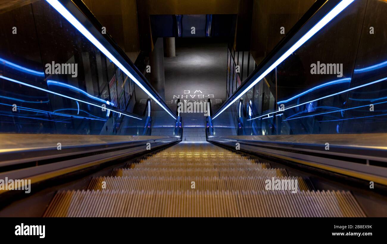 Moving escalator to subway in Munich, Germany Stock Photo