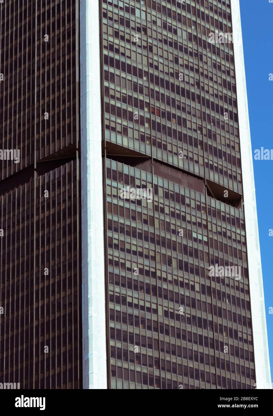 View of a skyscraper and blue sky in background Stock Photo - Alamy