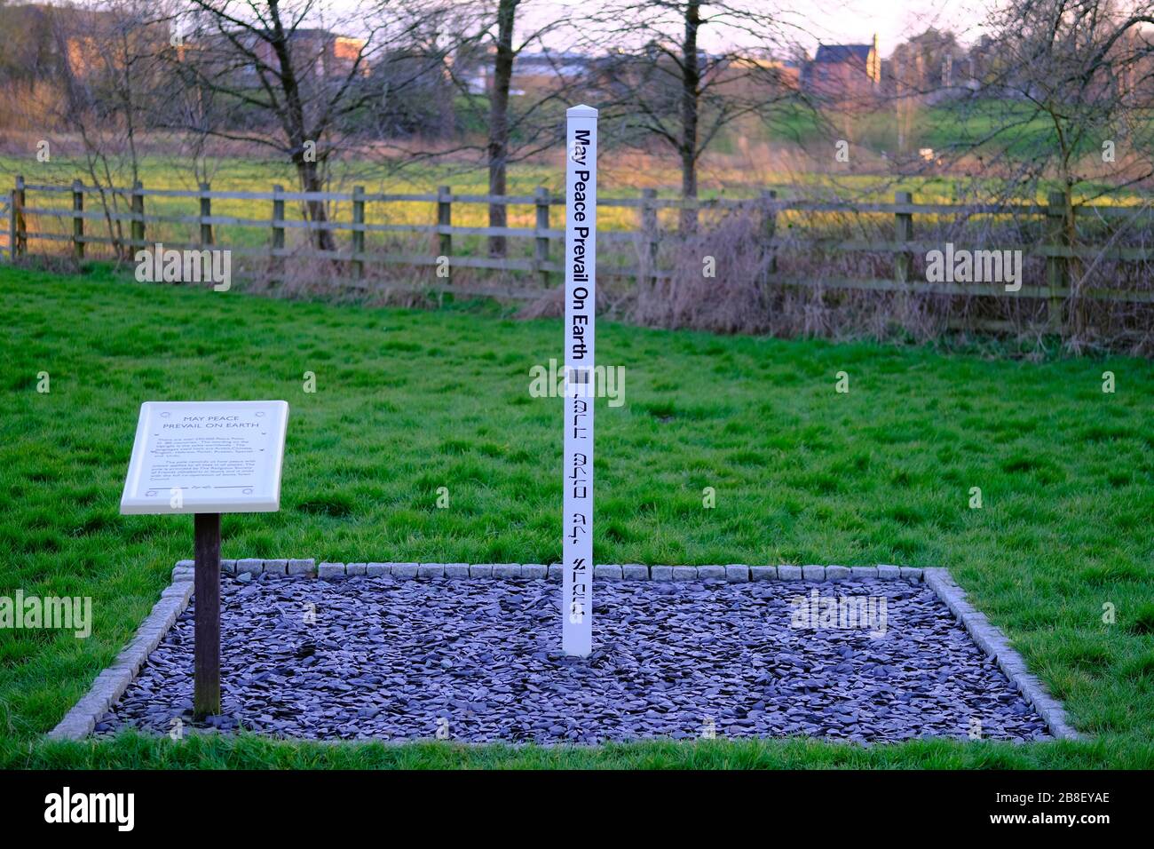 The Peace Pole with words May peace prevail on Earth. Installed by the