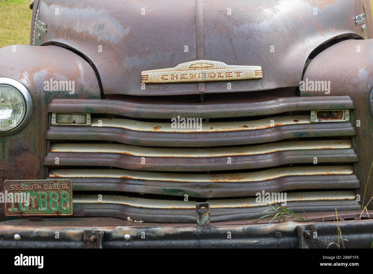 Hood of a wrecked Chevrolet in a junk yard Stock Photo Alamy