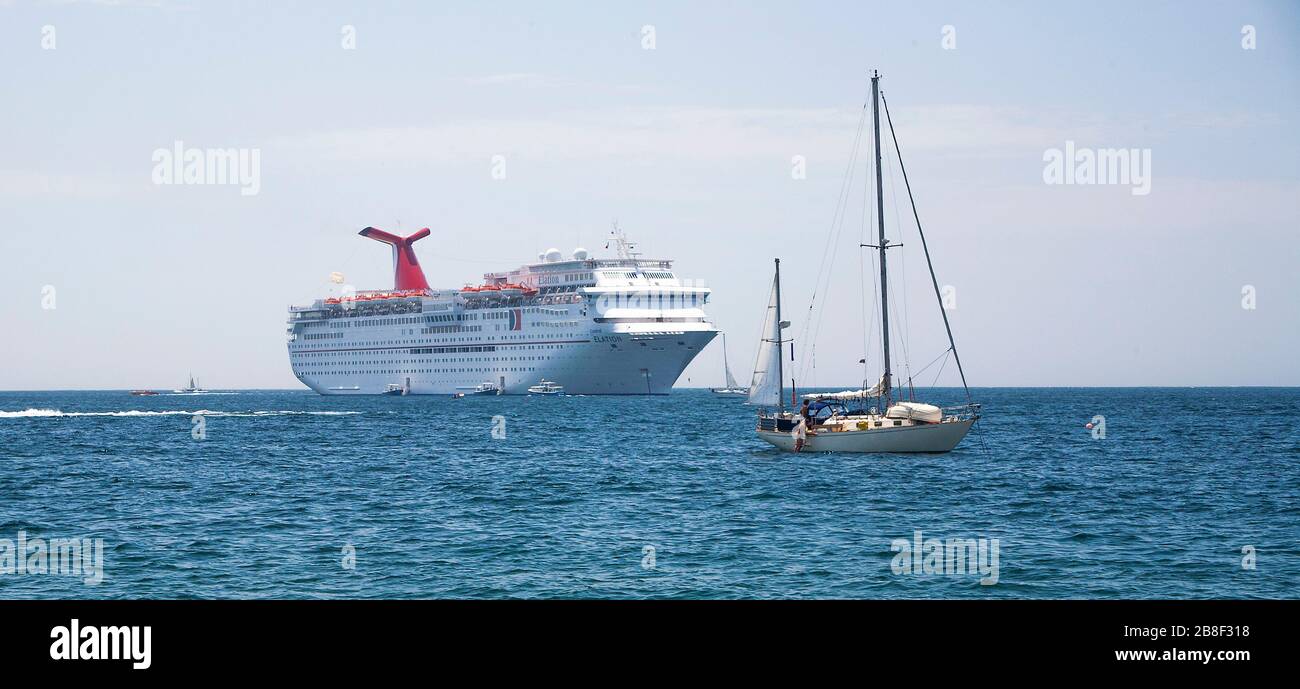 Small boats around Carnival Elation cruise ship off Cabo San Lucas, Baja California Sur, Mexico Stock Photo
