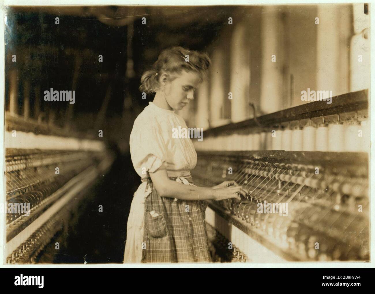 Girl in Cherryville Mill. Stock Photo