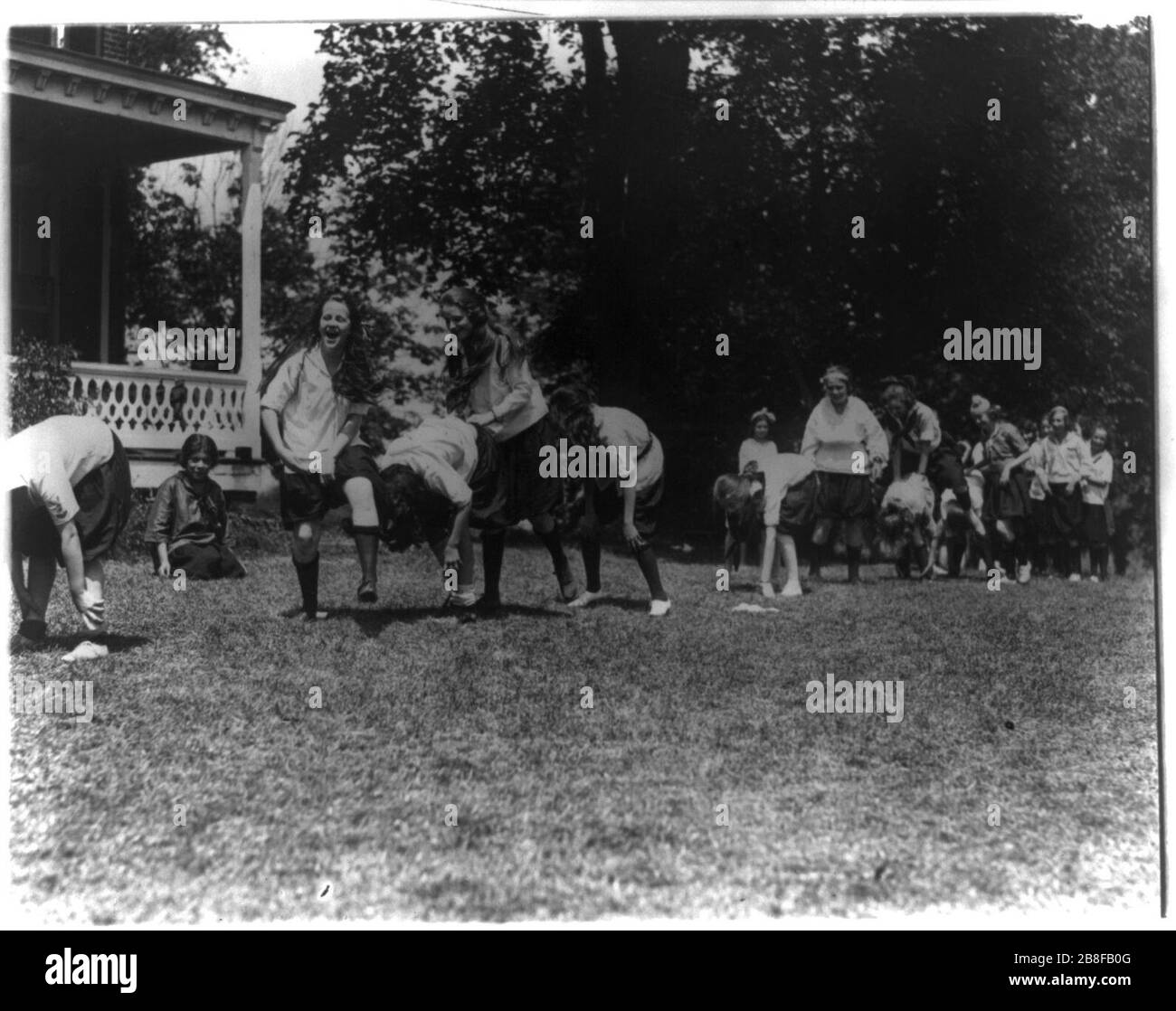 Girls from Washington, D.C., at Y.W.C.A. camp near Winona, Maryland, playing leapfrog Stock Photo