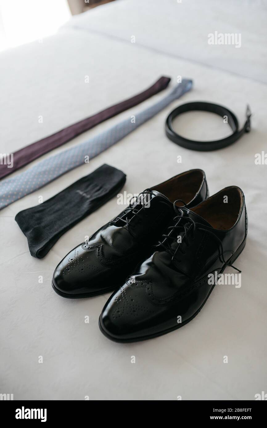 Black shoes, tie, socks and belt Stock Photo - Alamy