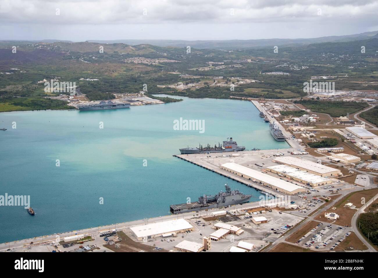 200321-N-RU810-1075 NAVAL BASE GUAM (March 21, 2020) Amphibious assault ship USS America (LHA 6), San Antonio-class dock landing ship USS Green Bay (LPD 20) and Whidbey Island-class dock landing ship USS Germantown (LSD 42), all part of the America Expeditionary Strike Group, operate from Naval Base Guam with USNS Rappahannock (T-AO 204). Operating in the U.S. 7th Fleet area of operations, the America ESG-31st Marine Expeditionary Unit team of 4,500 Sailors and Marines is prepared to conduct missions across the full spectrum of military operations. (U.S. Navy photo by Mass Communication Specia Stock Photo