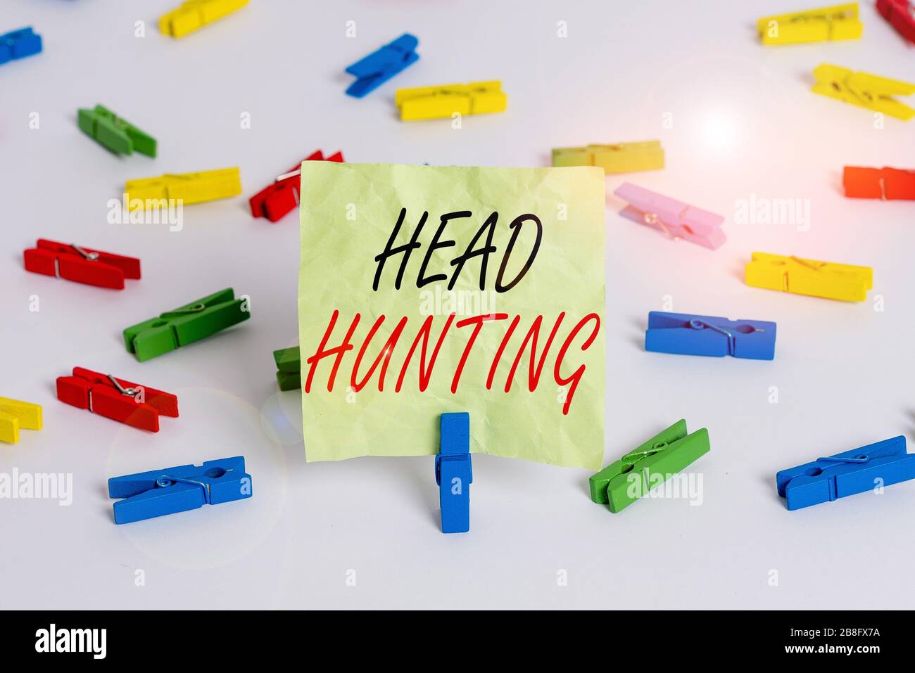 Writing note showing Head Hunting. Business concept for process of