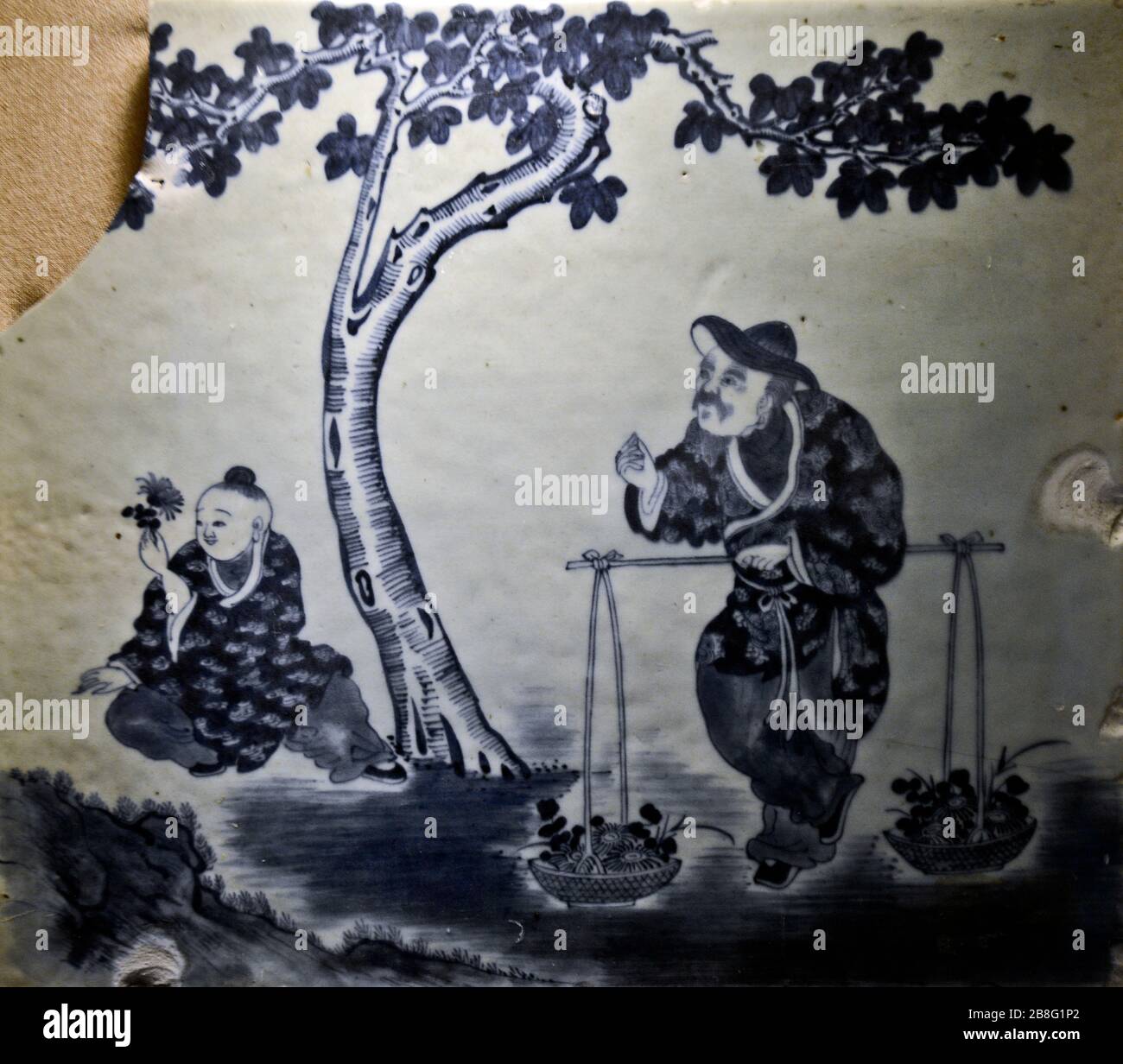 Blue and white ceramic tile with figurine design. Wuhan Museum, China Stock Photo