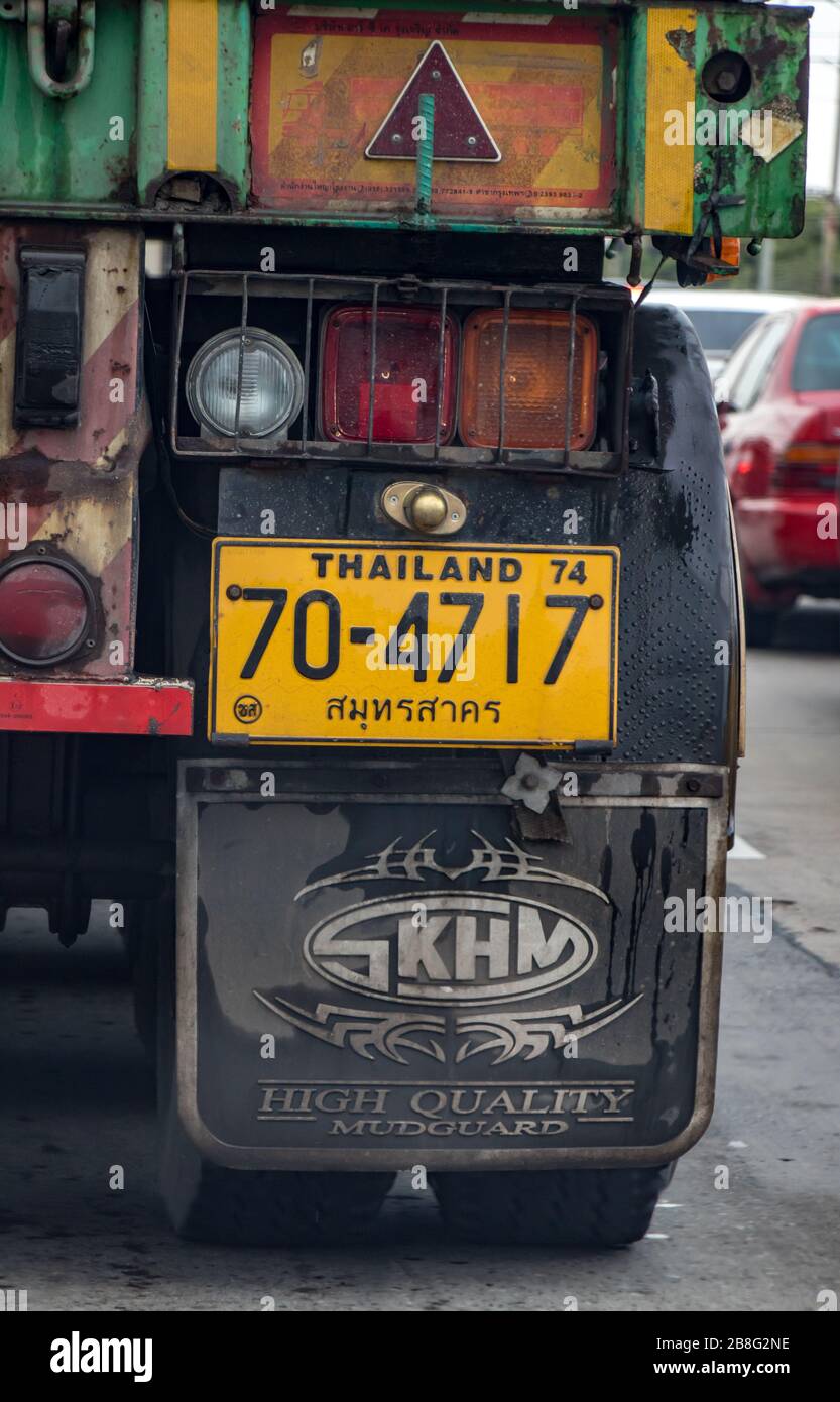 BANGKOK,  THAILAND, SEP 21 2019,The detailed look at back wheel of truck with mud flap, back lighting and registration number - car license plate. Stock Photo