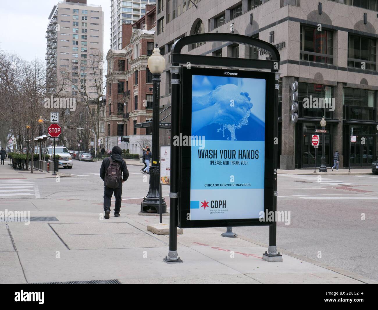 Chicago, Illinois, USA. 21st March, 2020. An electonic sign in the Rush Street neighborhood urges people to wash their hands as a precaution against COVID-19. Governor Pritzker has issued a stay at home order effective at 5pm local time today. Stock Photo