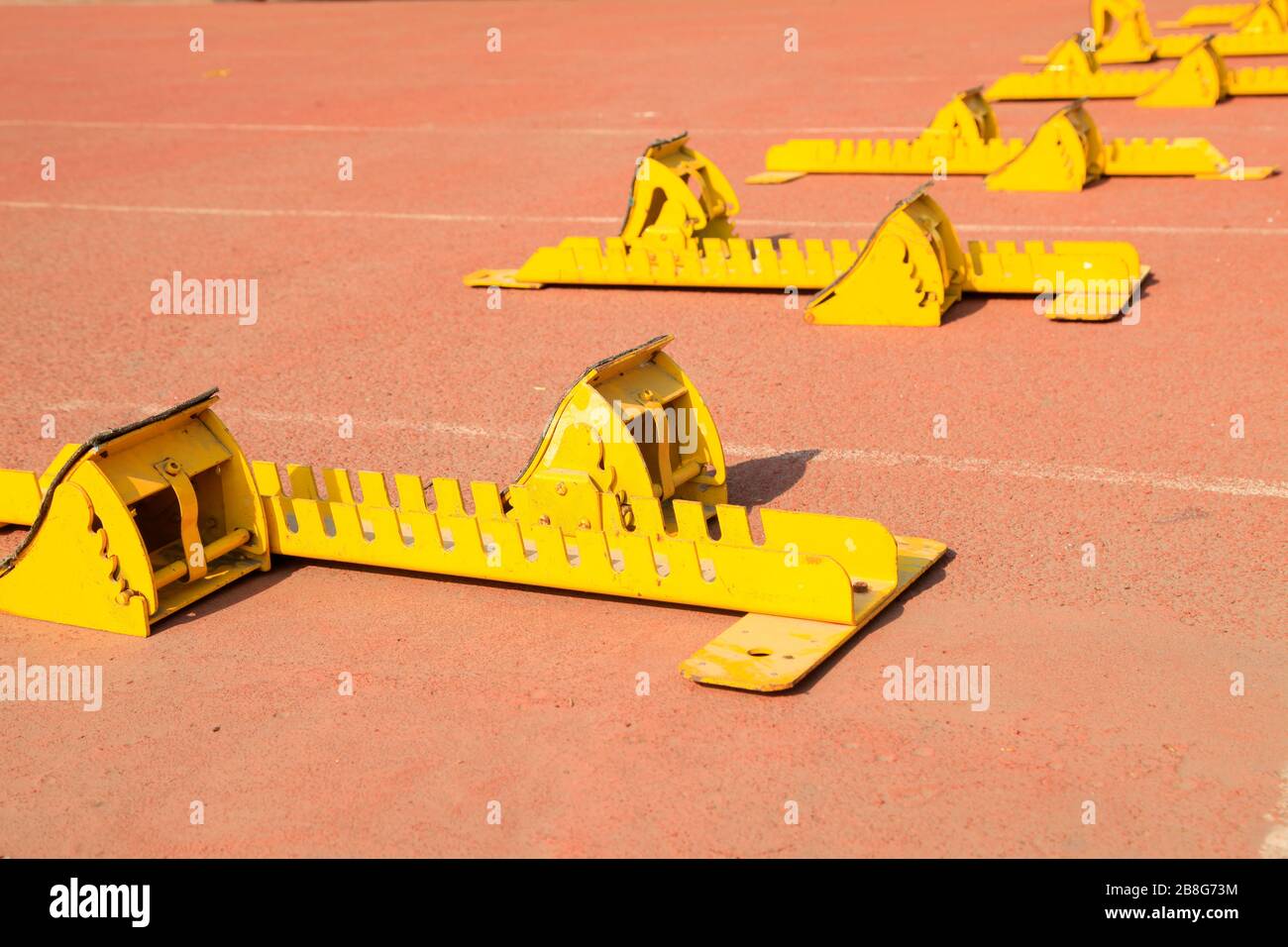 The starting blocks are on the track in the playground Stock Photo - Alamy