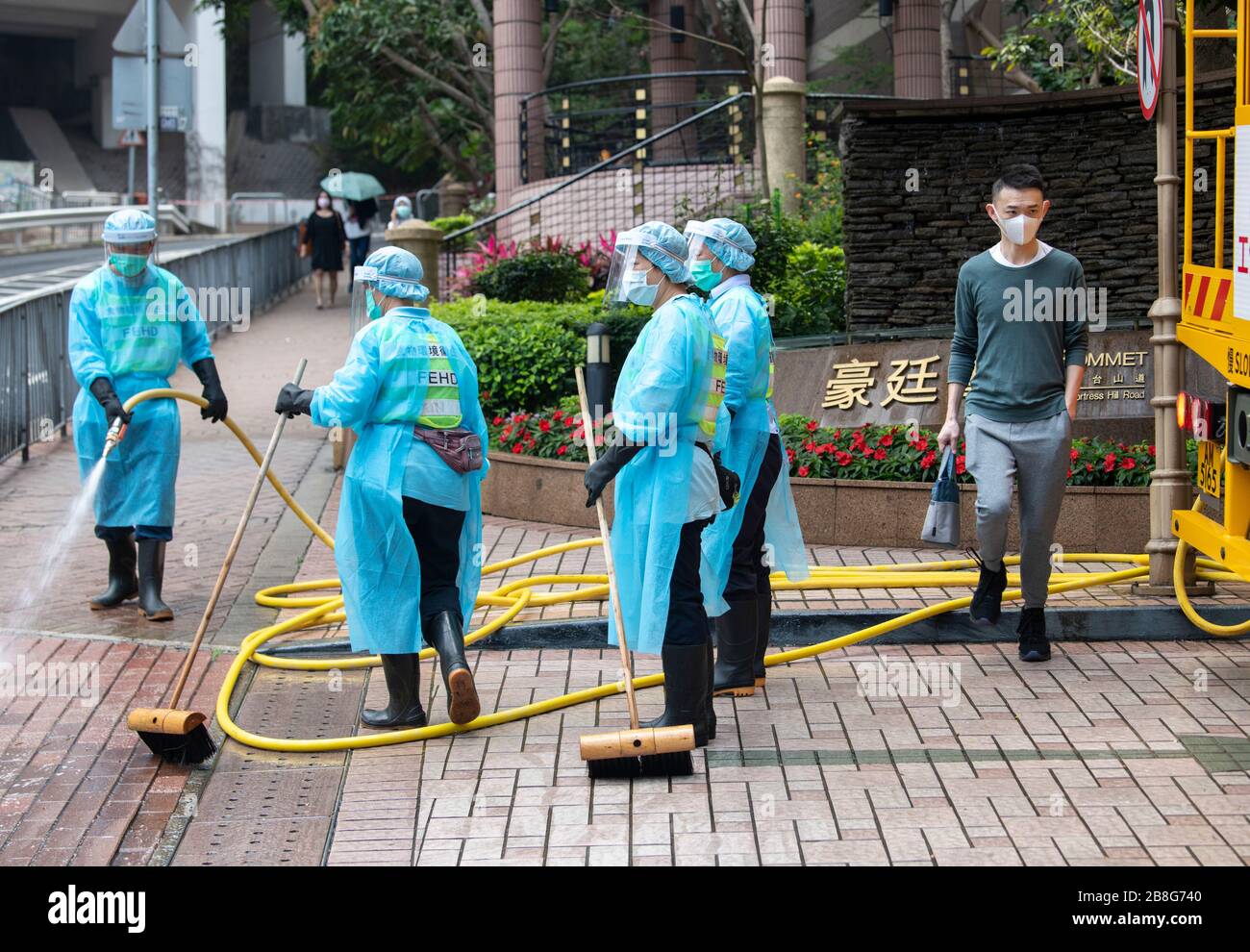 Hong Kong, Hong Kong, China. 10th Mar, 2020. Workers from the FEHD (The Food and Environmental Hygiene Department of the Hong Kong Government) disinfect the streets in Fortress Hill amid a rapid spike of Cover-19 virus infections.As the pandemic takes hold Hong Kongers, including students and travelers rushed back to the city before the border closure bringing the infection with them. Credit: Jayne Russell/ZUMA Wire/Alamy Live News Stock Photo