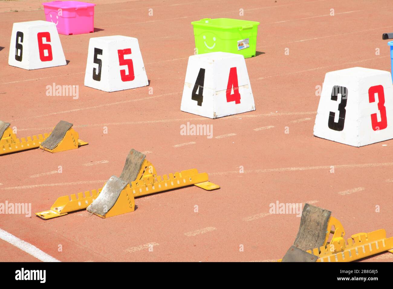 The starting blocks are on the track in the playground Stock Photo - Alamy