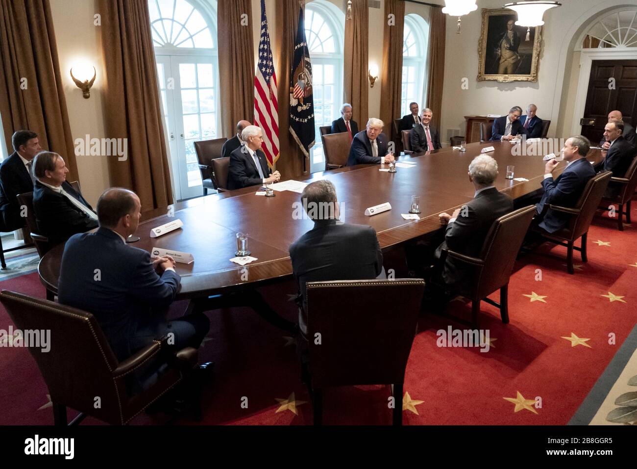 Washington, United States Of America. 17th Mar, 2020. President Donald J. Trump, joined by Vice President Mike Pence, meets with tourism industry executives to discuss the healthcare and economic responses to the coronavirus outbreak Tuesday, March 17, 2020, in the Cabinet Room of the White House. People: President Donald Trump Credit: Storms Media Group/Alamy Live News Stock Photo