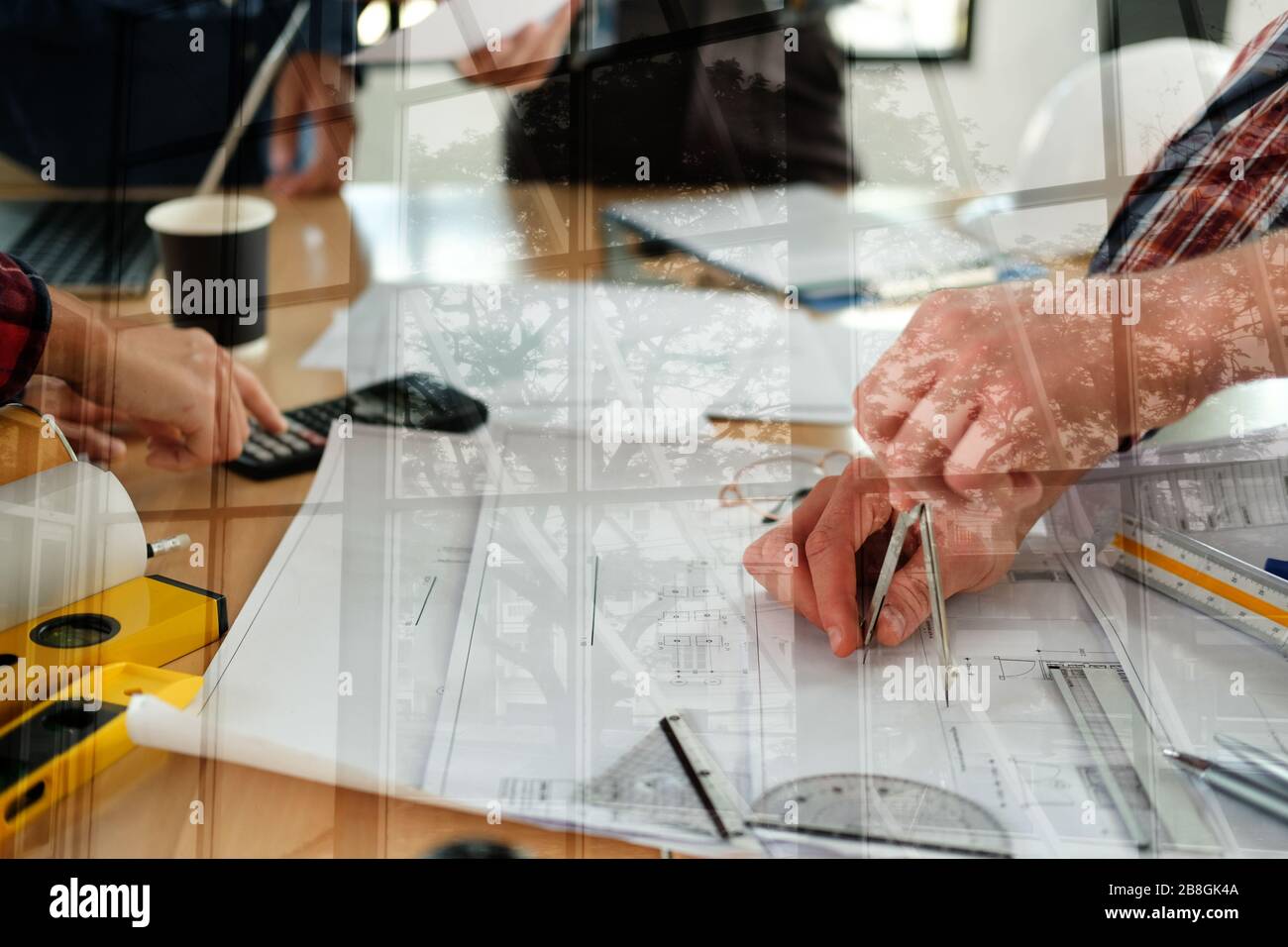 architect engineer interior designer team working discussing on house blueprint of real estate project in meeting. building construction teamwork conc Stock Photo