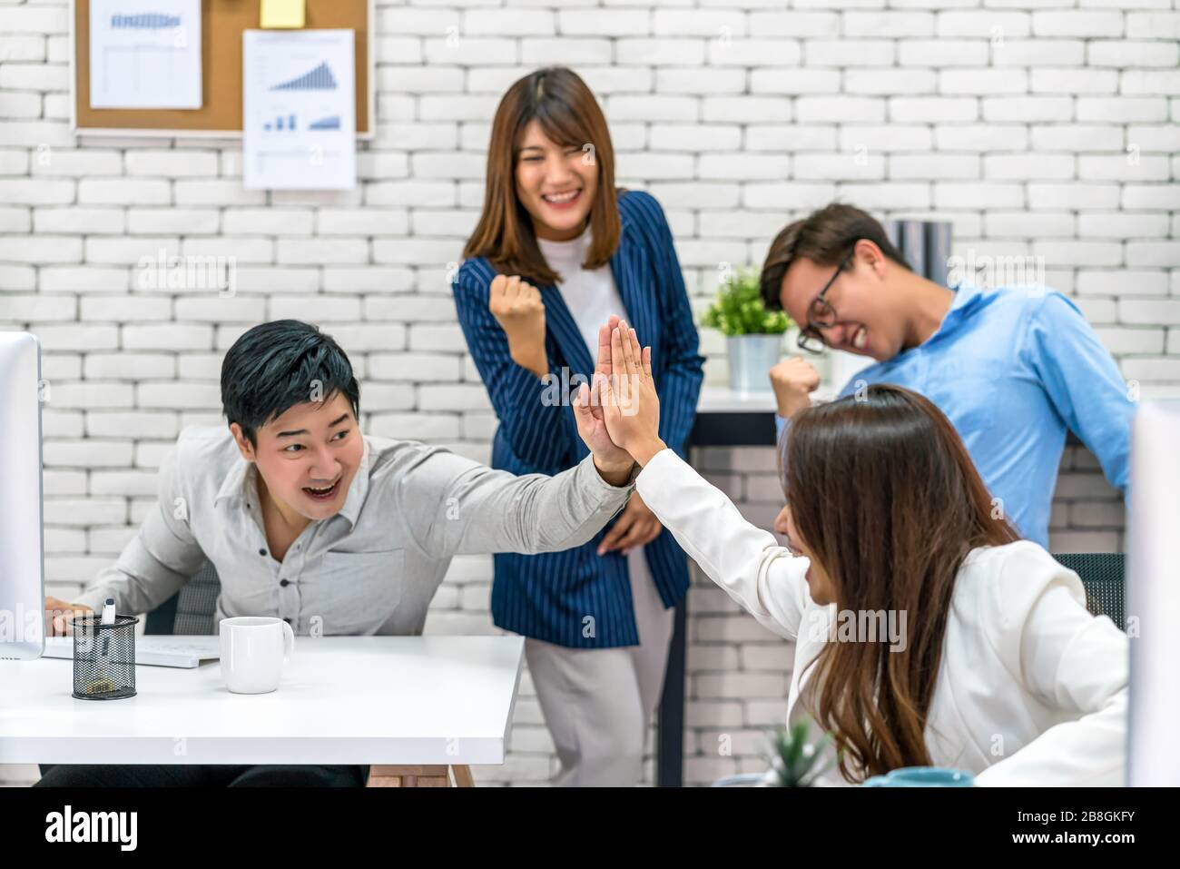 Group Of Asian Business people celebrating and giving high five ...