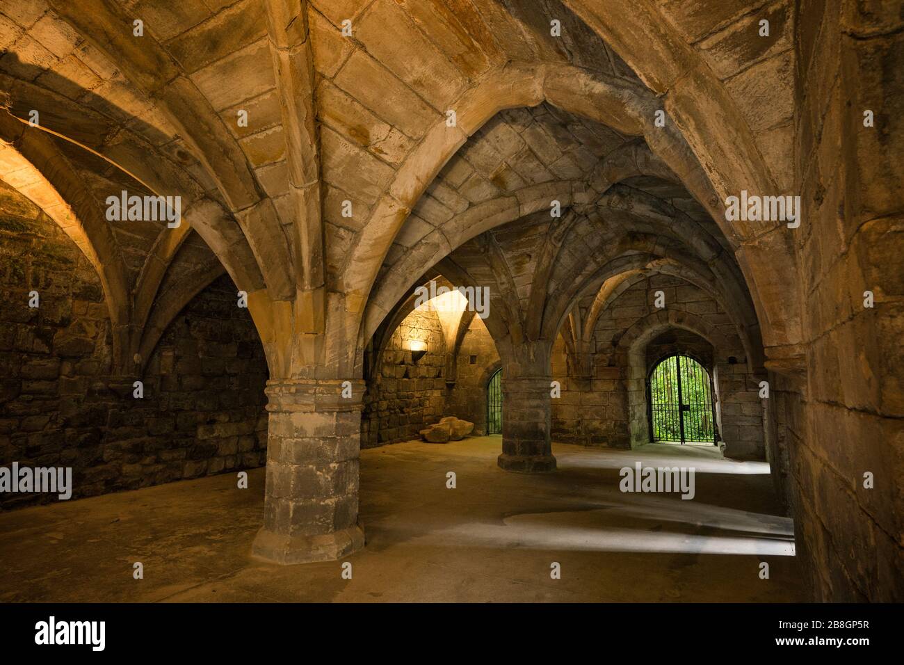 Arches and curved architecture inside the crypt of the Dunfermline Abbey, founded in 1128 as a Benedictine abbey, a Scotland Parish Church in the hist Stock Photo