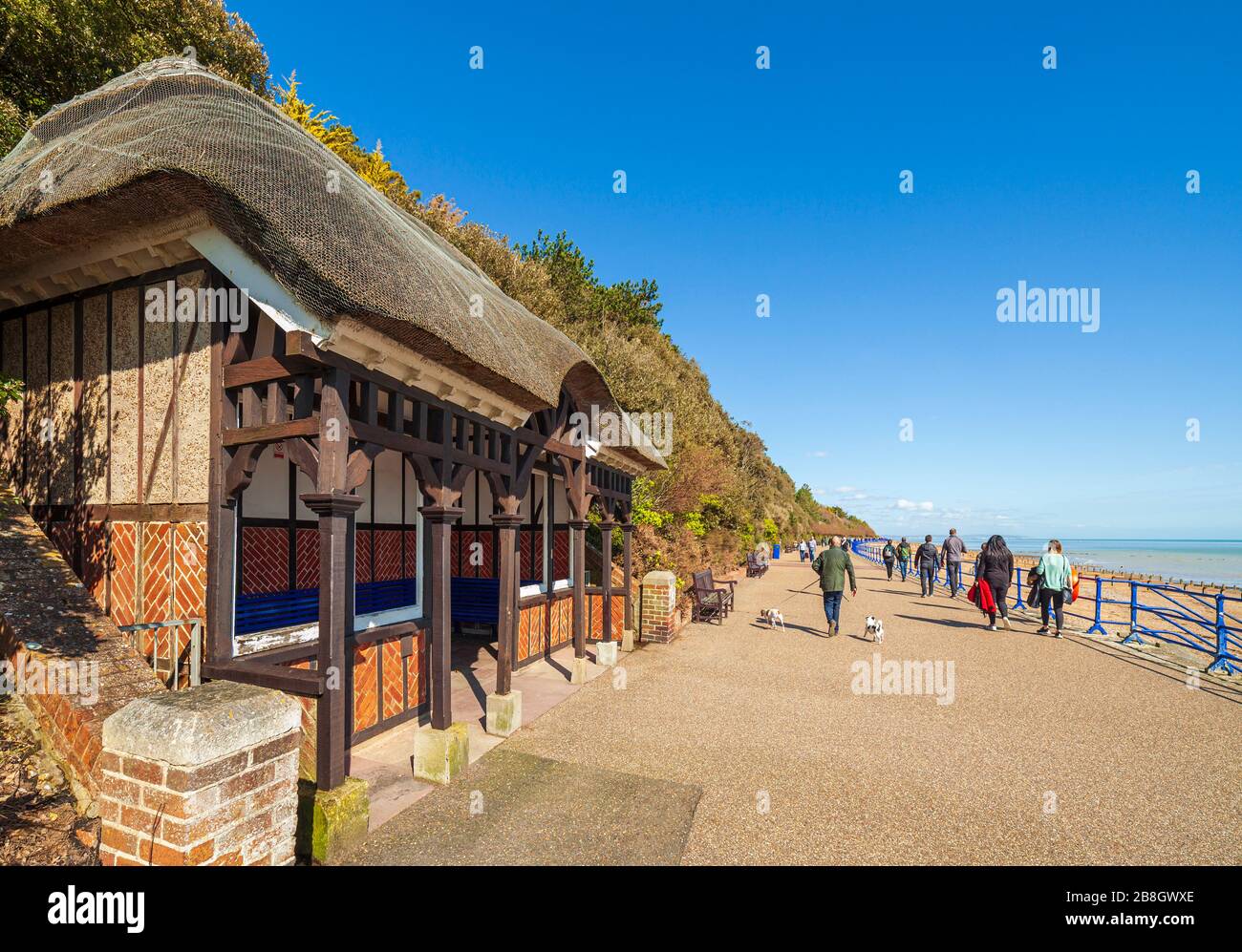 The Promenade and thatched shelter Eastbourne. Stock Photo