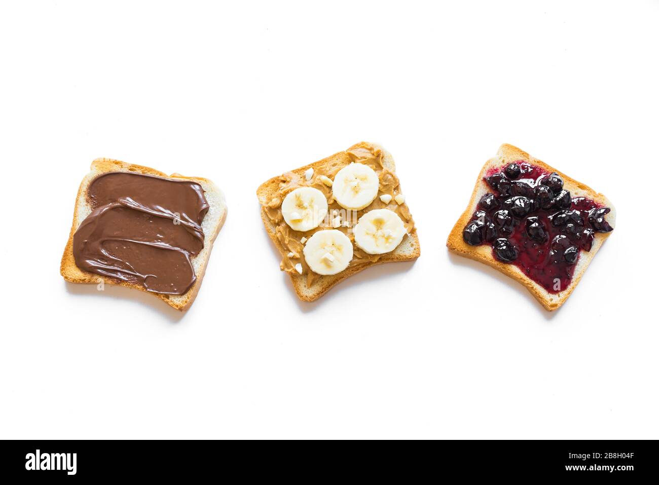 Three toasts, bread with chocolate spread, peanut butter and jam