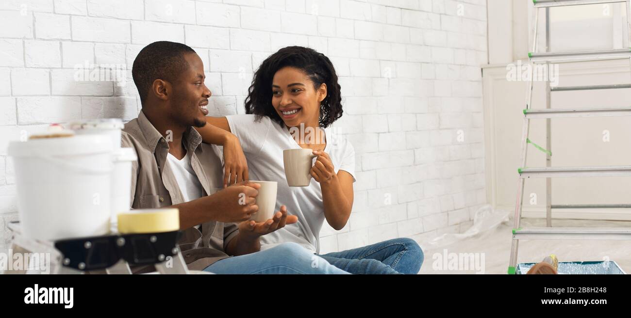 African american boy and girl drink coffee Stock Photo