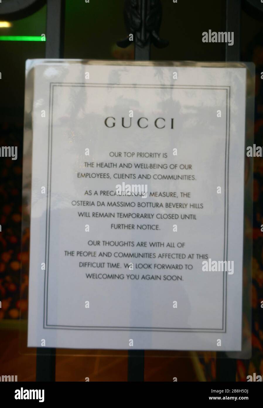 Beverly Hills, California, USA 21st March 2020 A general view of atmosphere of Gucci store on Rodeo Drive closed due to coronavirus outbreak and people practice social distancing in Beverly Hills, California, USA. Photo by Barry King/Alamy Stock Photo Stock Photo