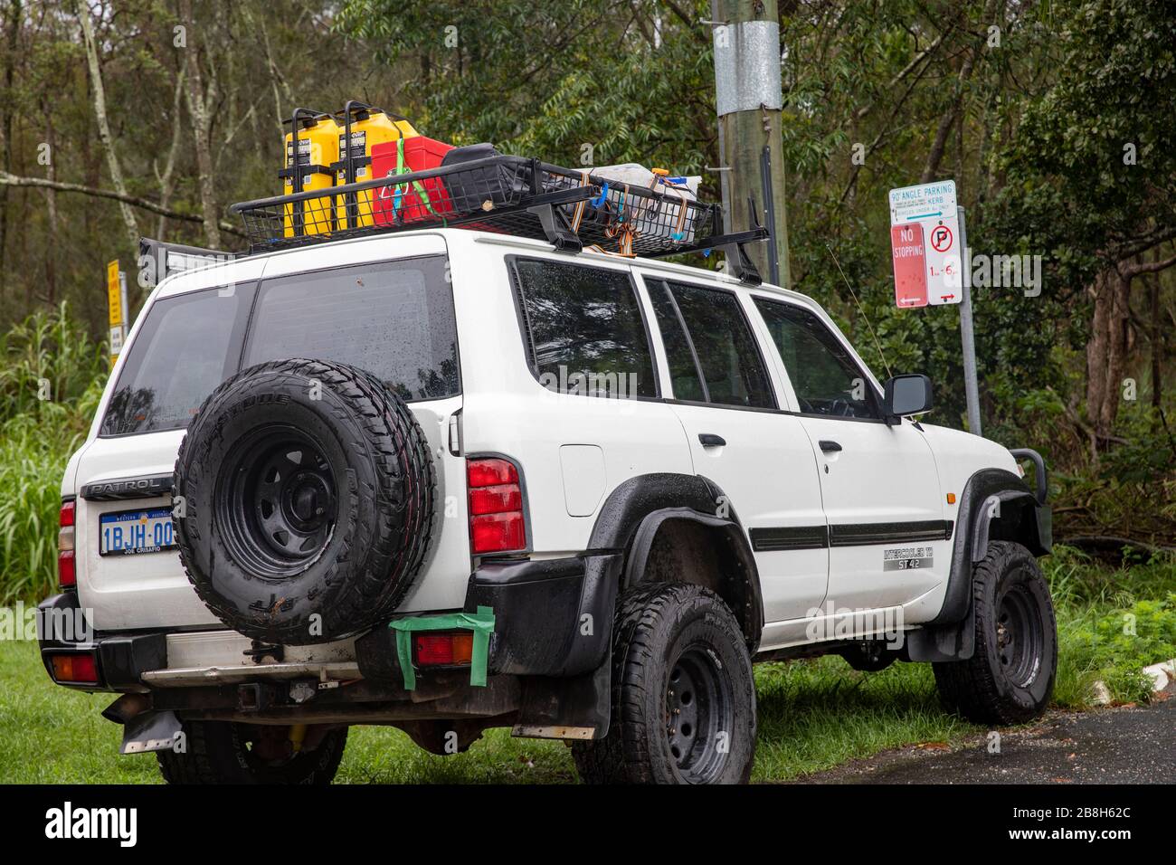 Nissan Patrol off road vehicle carrying supplies and spare fuel, Australia Stock Photo