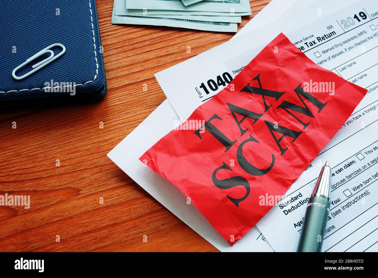 IRS tax scam phrase and empty forms. Stock Photo