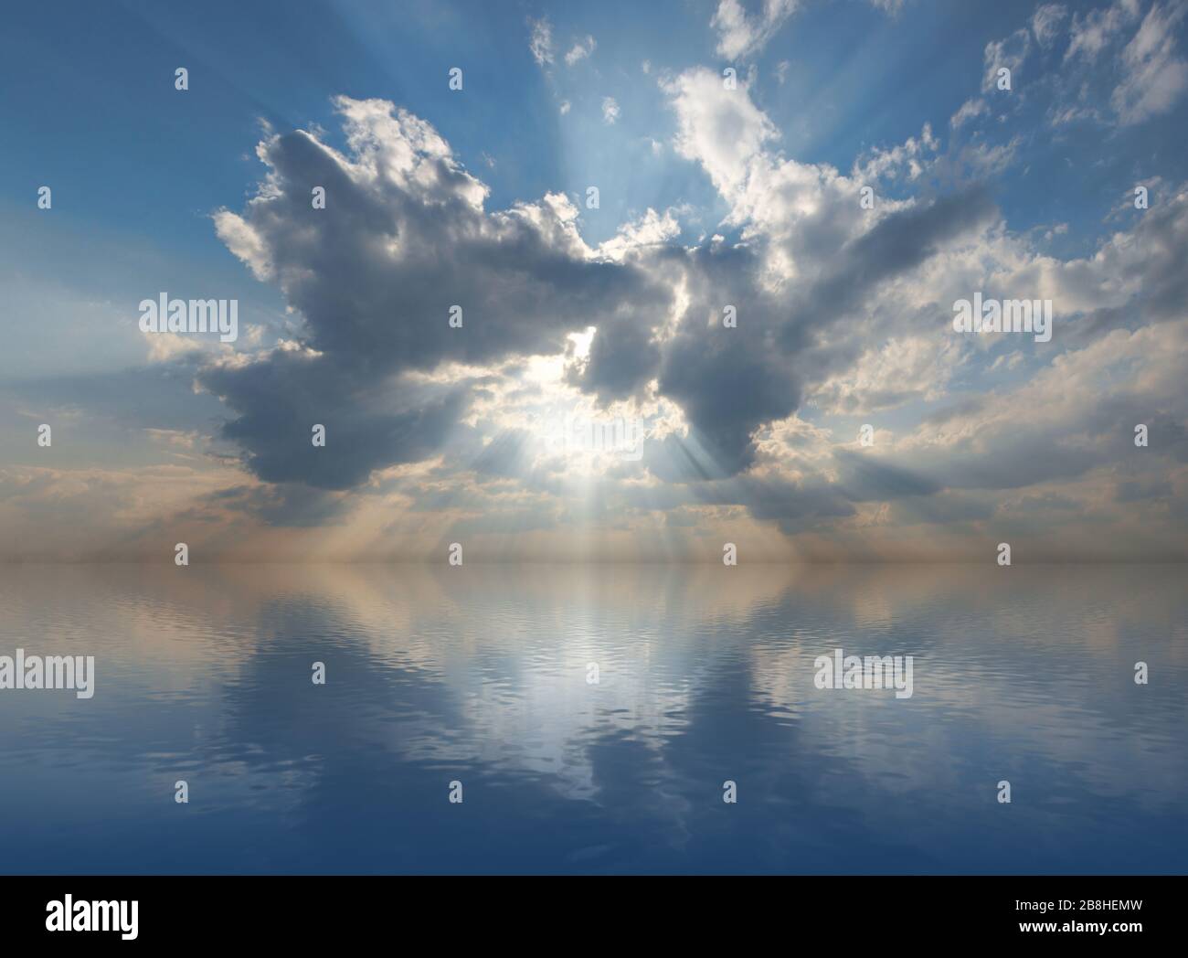 Sun as bursting through clouds in a blue sky. Stock Photo