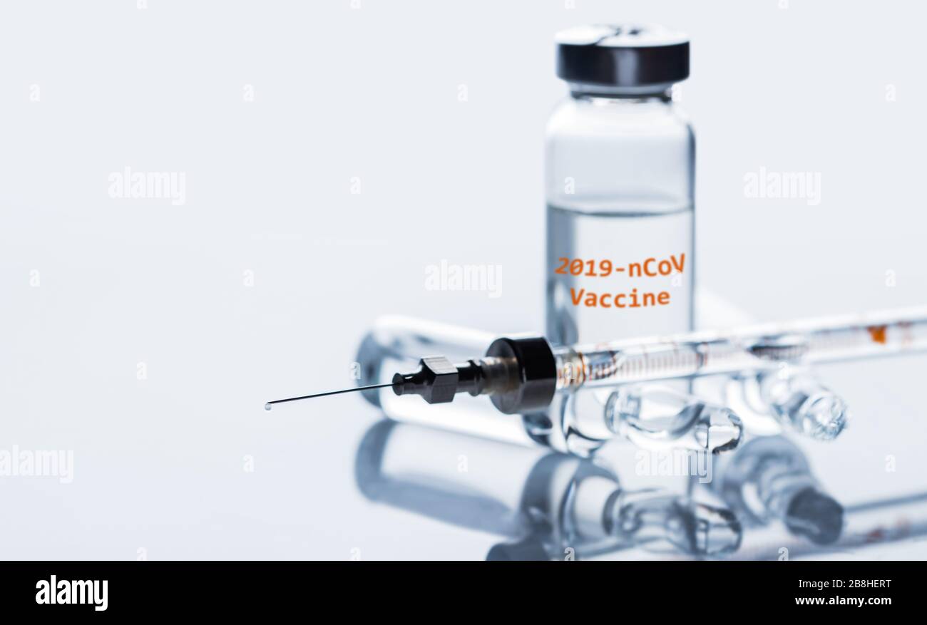 Vaccine and syringe injection, coronavirus disease 2019,COVID-19,nCoV 2019. Medicine infectious concept. Stock Photo