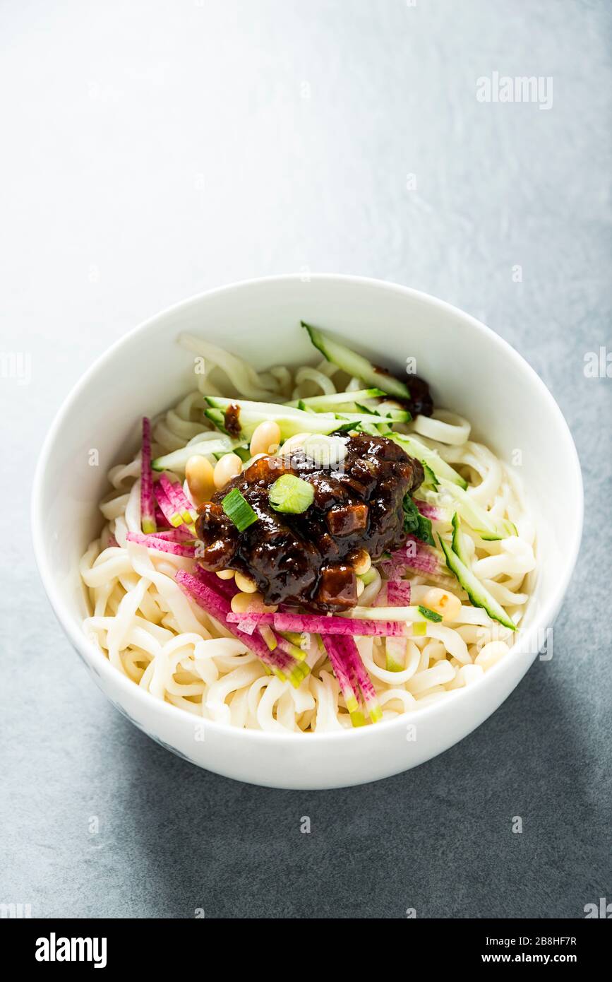 Bowl of Noodles with Soy Bean Paste in Beijing, China Bowl of Noodles with Soy Bean Paste in Beijing, China Stock Photo