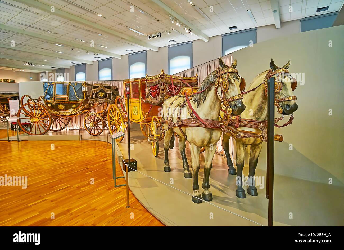 VIENNA, AUSTRIA - FEBRUARY 19, 2019: Interior of Imperial Carriage museum of Schonbrunn with extant carriages of Habsburg family and horse replicas, o Stock Photo