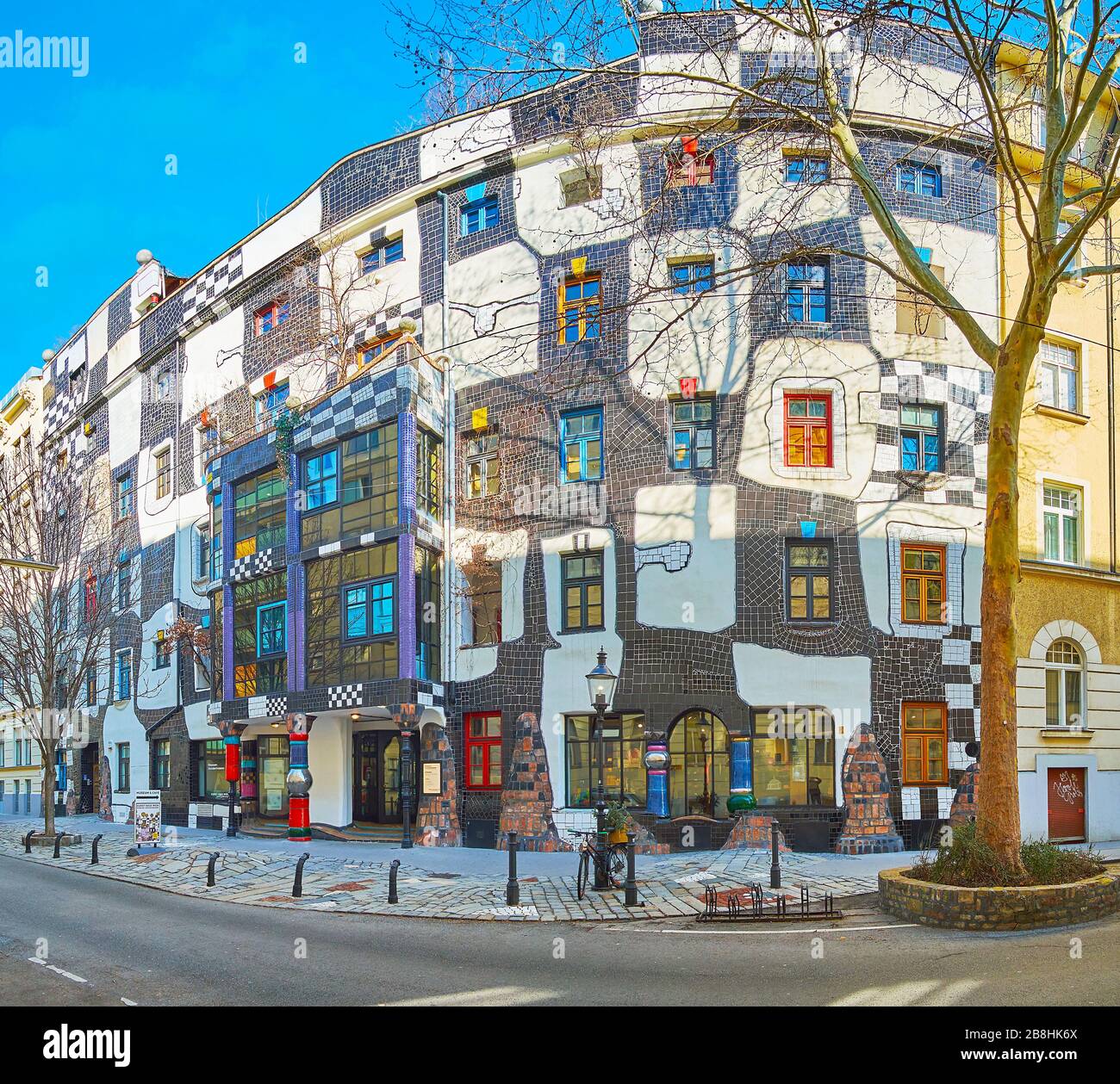 VIENNA, AUSTRIA - FEBRUARY 19, 2019: The beautiful facade of Hundertwasser museum (Kunst Haus Wien), decorated with black-white tilling, pillars, colo Stock Photo