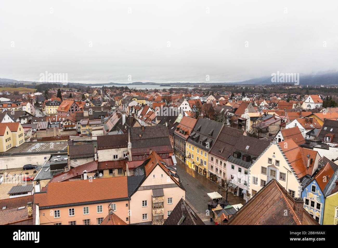 Aerial view of the old town of Fussen on a cloudy winter day from the Hohes Schloss castle, with the Forggensee lake in background, Allgaeu, Bavaria, Stock Photo