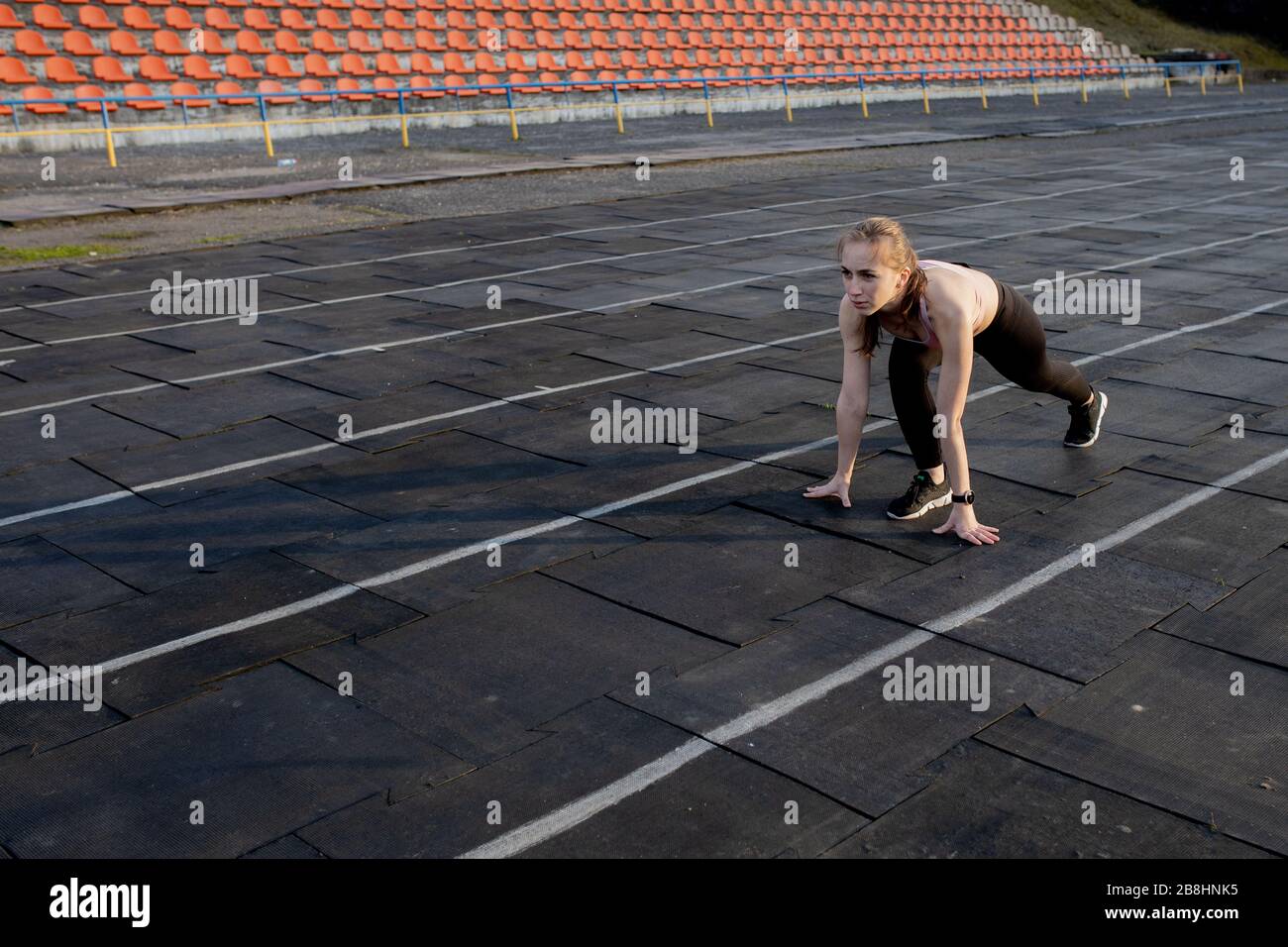 Women getting ready to start running in a stadium Stock Photo - Alamy