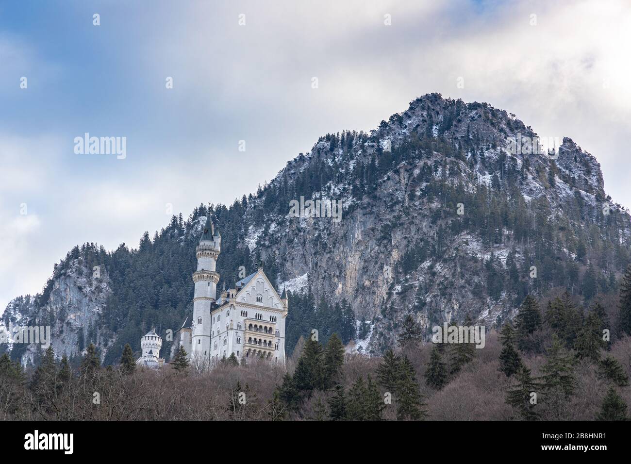 Beautiful view of the famous Neuschwanstein Castle located on the hill from the bottom of Schwangau in winter, Bavaria, Germany Stock Photo