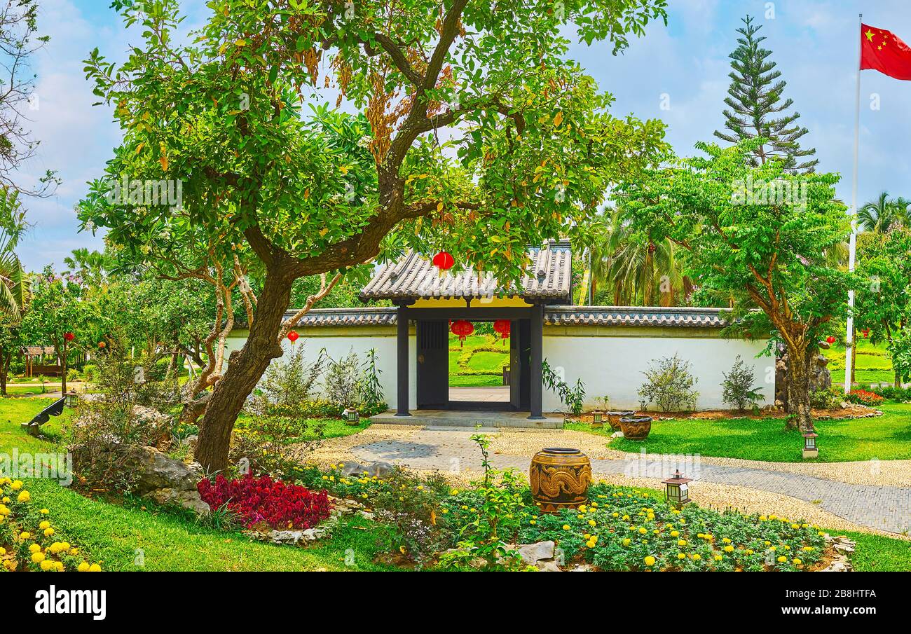 The view on scenic ornamental garden, the gate and flag of China garden, located in Rajapruek park, Chiang Mai, Thailand Stock Photo