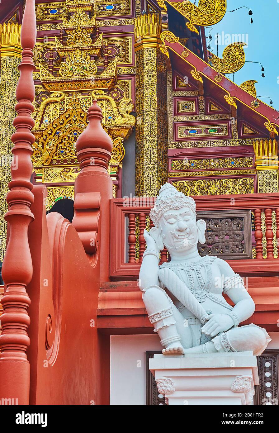 The white statue of Yaksha demon king, guarding the stairs of Royal pavilion in Rajapruek park, Chiang Mai, Thailand Stock Photo