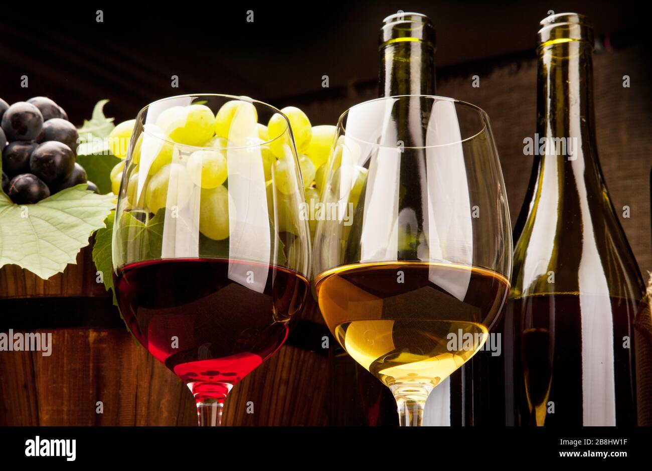 Still life with wine bottles, glasses and grapes Stock Photo - Alamy
