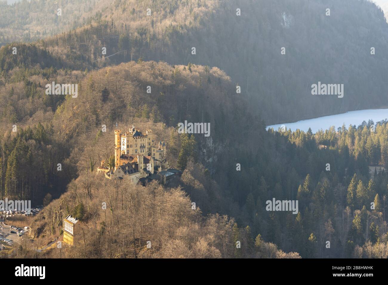 Aerial view of the Hohenschwangau Castle in beautiful sunshine on a sunny day in winter from the Neuschwanstein Castle, Schwangau, Bavaria, Germany Stock Photo