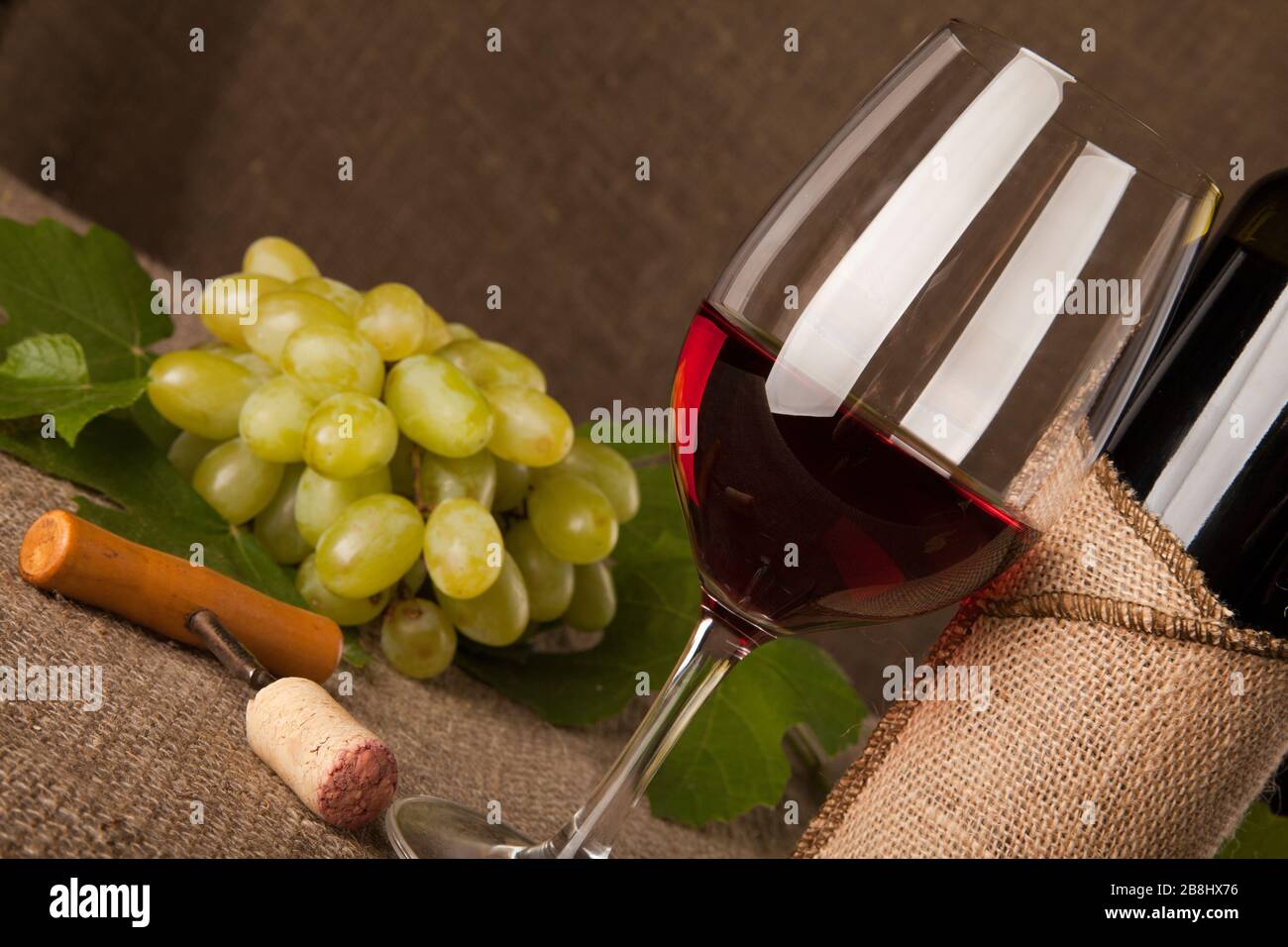 Still life with wine bottles, glasses and grapes Stock Photo - Alamy