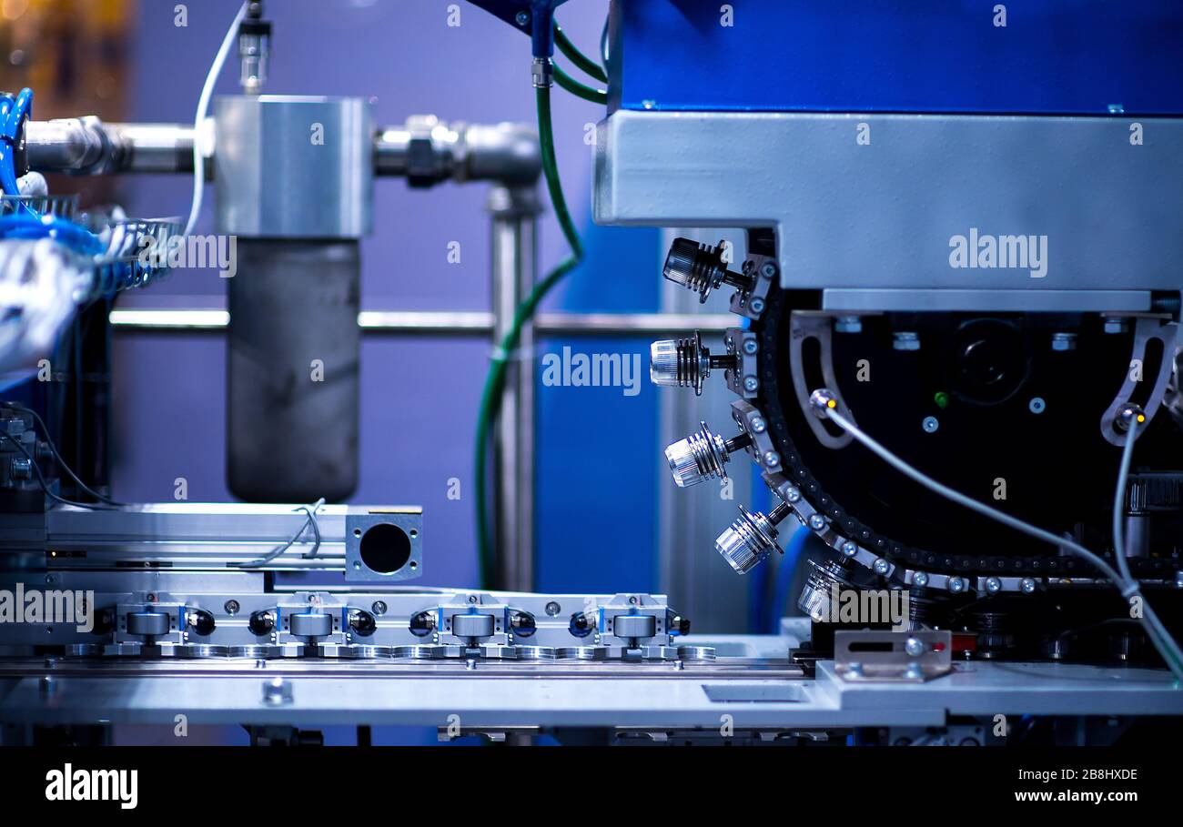 Production of the bottles plastic The Technological line on production of the plastic bottles. Conveyor automatic. Stock Photo