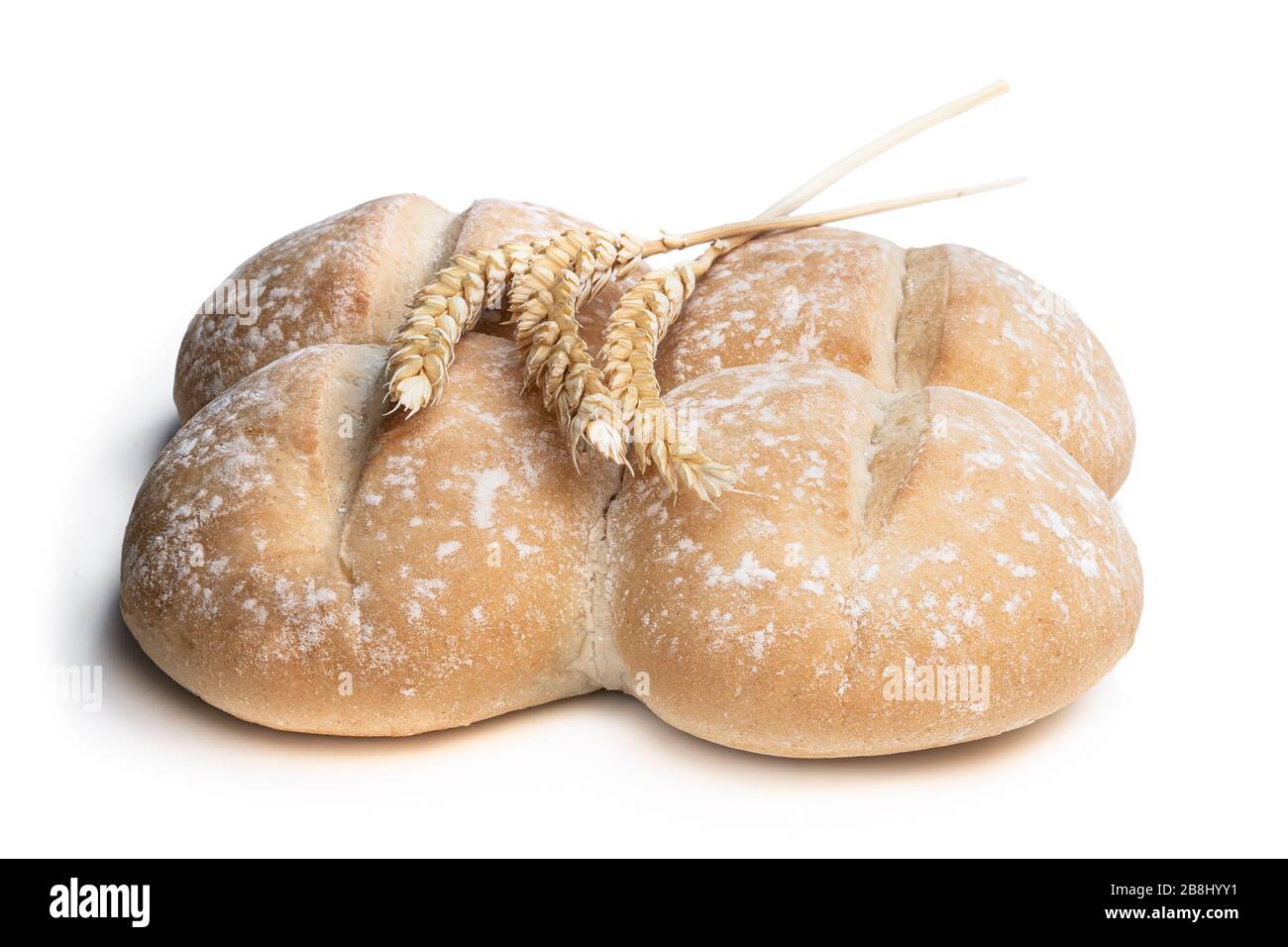 Wheat  bread rolls with ears isolated on white Stock Photo