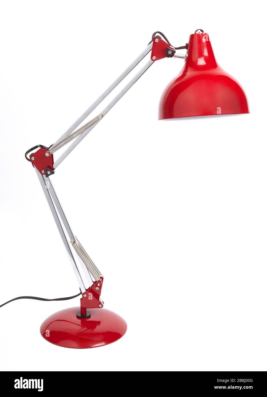 Red desk lamp with spiral type energy saving light. Isolated on white
