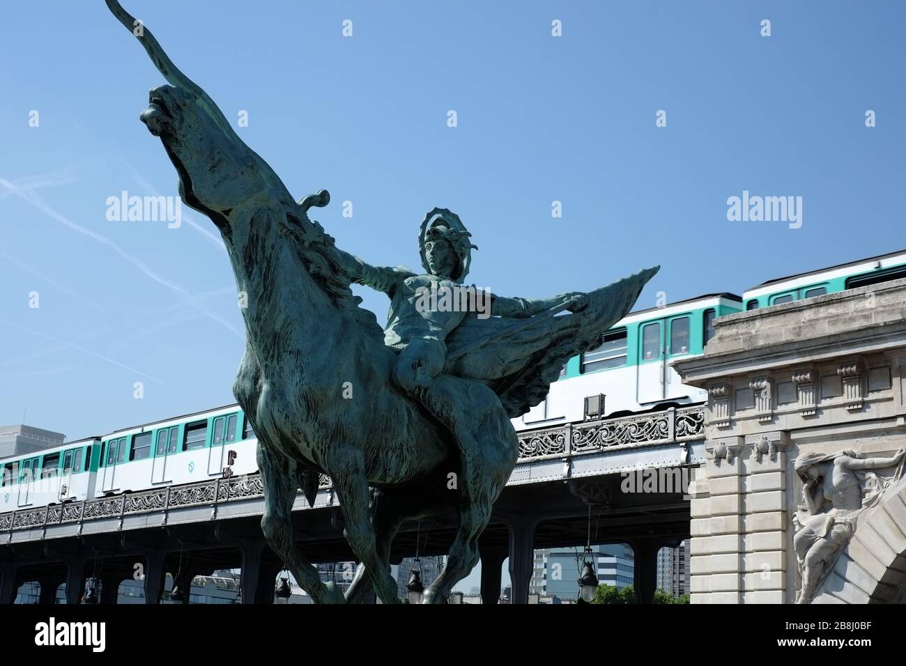 La France renaissante, bronze sculpture by Holger Wederkinch 1930, a warrior on a charging horse,  Pont de Bir-Hakeim, metro train, Paris; France Stock Photo