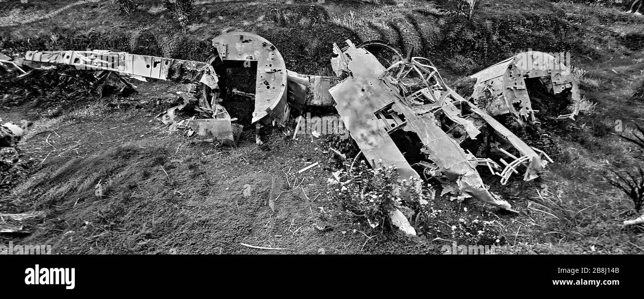 WW2 Japanese aircraft wreckage scattered among the palm trees Rabaul PNG   Japanese Aircraft Wreckage Rabaul PNG Papua New Guinea WW2 World War Two Stock Photo