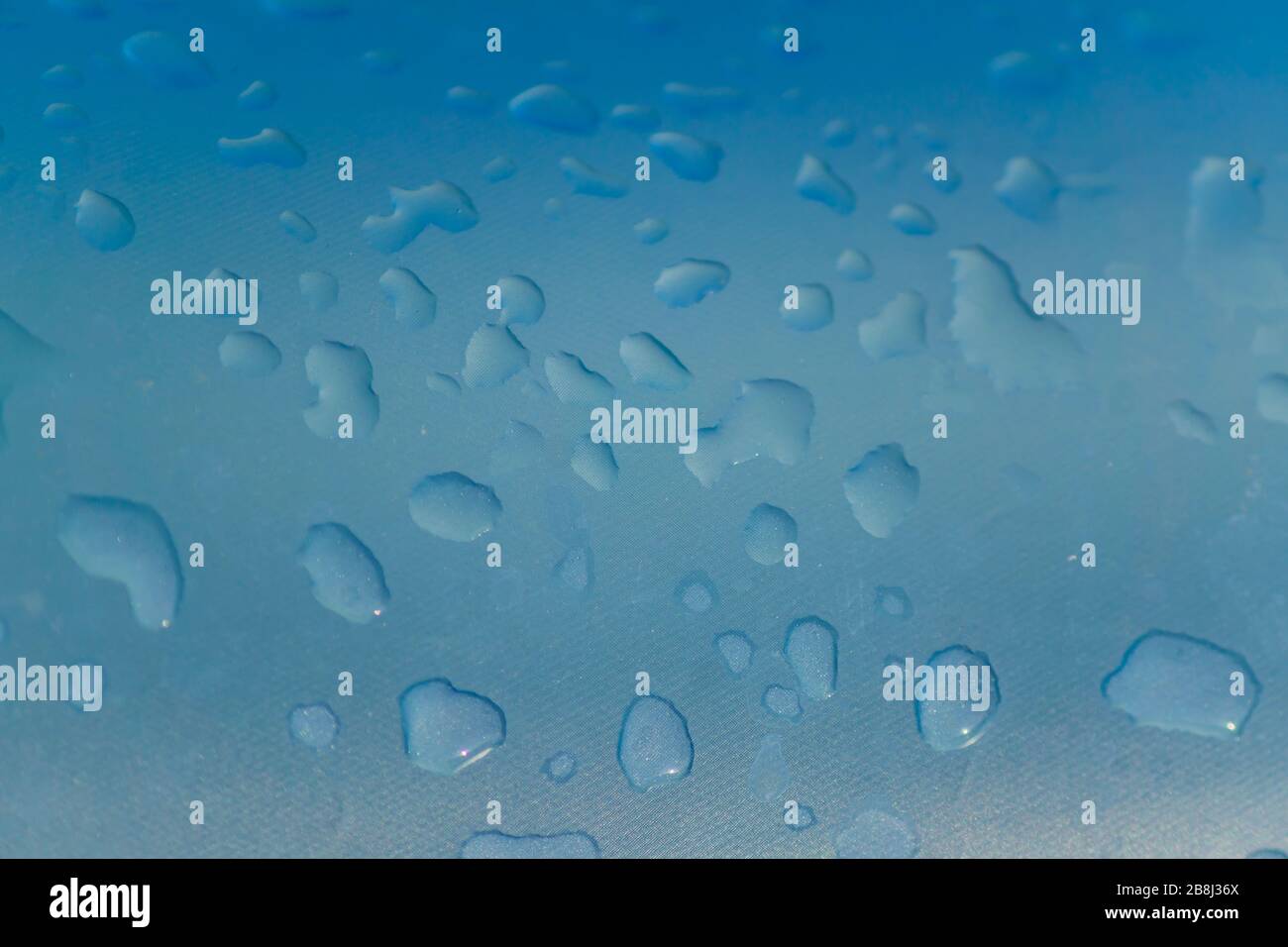 close up of water drops on Inflatable pool, background texture Stock Photo