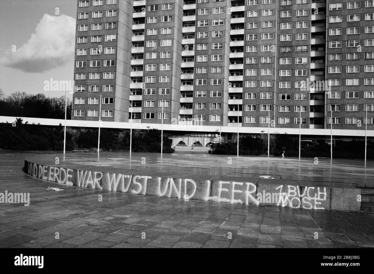 High-rise apartment blocks and graffiti in Lenin Allee in the former East Berlin. The Berlin Wall was a barrier constructed by the German Democratic Republic (GDR, East Germany) starting on 13 August 1961, that completely cut off West Berlin from surrounding East Germany and from East Berlin. The Wall was opened on 9. November 1989 allowing free movement of people from east to west. Stock Photo