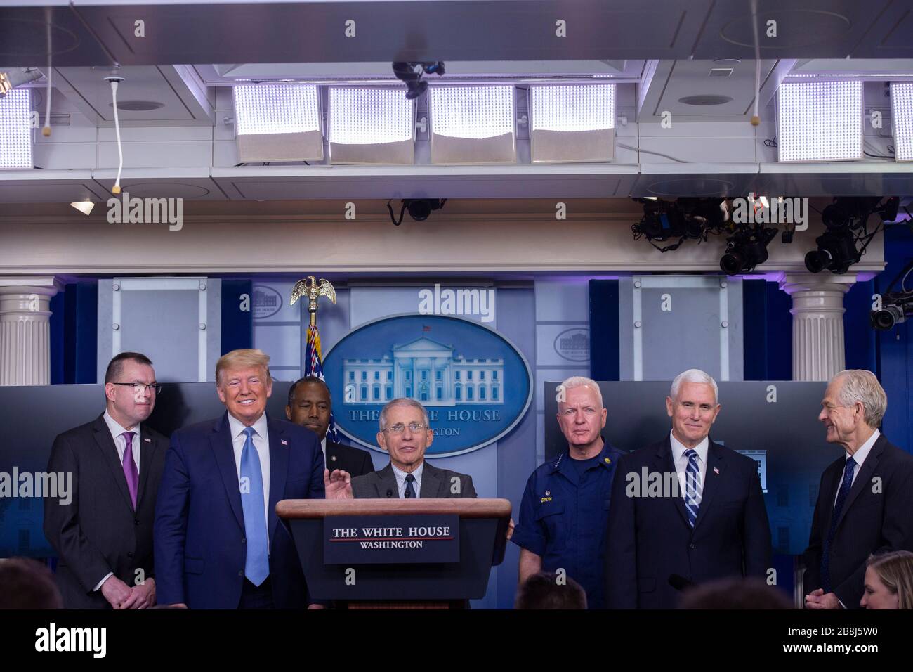 Director of the National Institute of Allergy and Infectious Diseases at the National Institutes of Health Dr. Anthony Fauci, center, makes remarks on the Coronavirus crisis in the Brady Press Briefing Room of the White House in Washington, DC on Saturday, March 21, 2020. From left to right: Pete Gaynor, Administrator, Federal Emergency Management Agency (FEMA); United States President Donald J. Trump; United States Secretary of Housing and Urban Development (HUD) Ben Carson; Dr. Fauci; Admiral Brett Giroir, United States Assistant Secretary for Health; United States Vice President Mike Pence Stock Photo