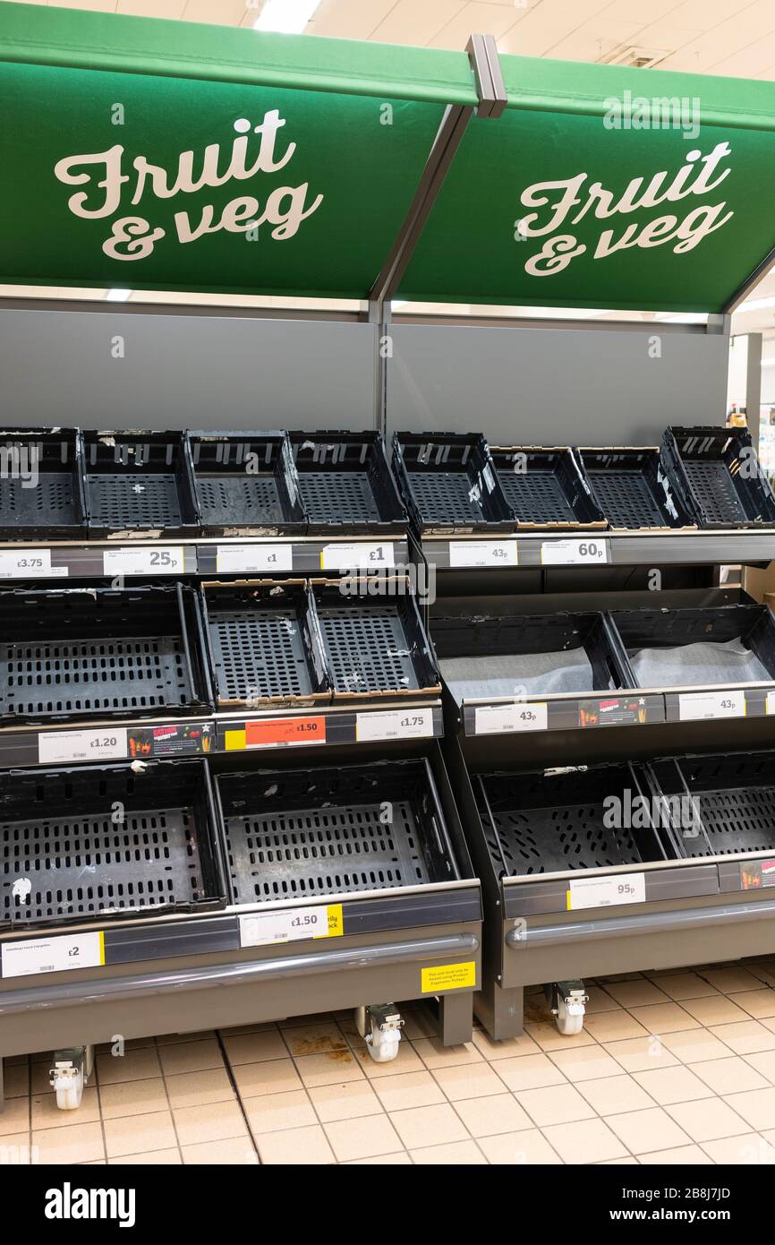Empty fresh food supermarket shelves in Sainsbury's from shoppers panic buying during the Coronavirus Covid 19 Pandemic, Basingstoke, UK, March 2020 Stock Photo