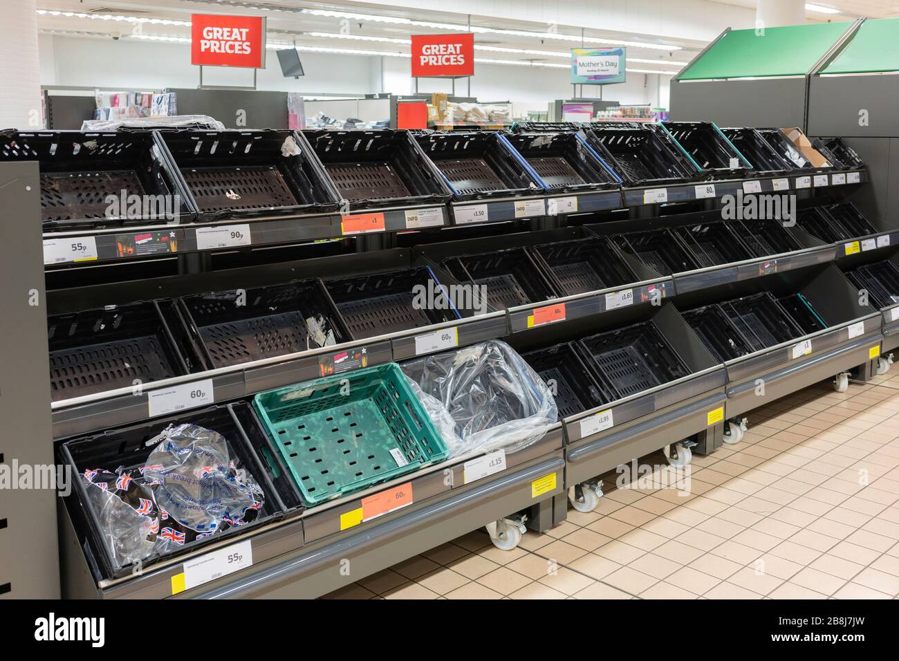 Empty fresh food supermarket shelves in Sainsbury's from shoppers panic buying during the Coronavirus Covid 19 Pandemic, Basingstoke, UK, March 2020 Stock Photo