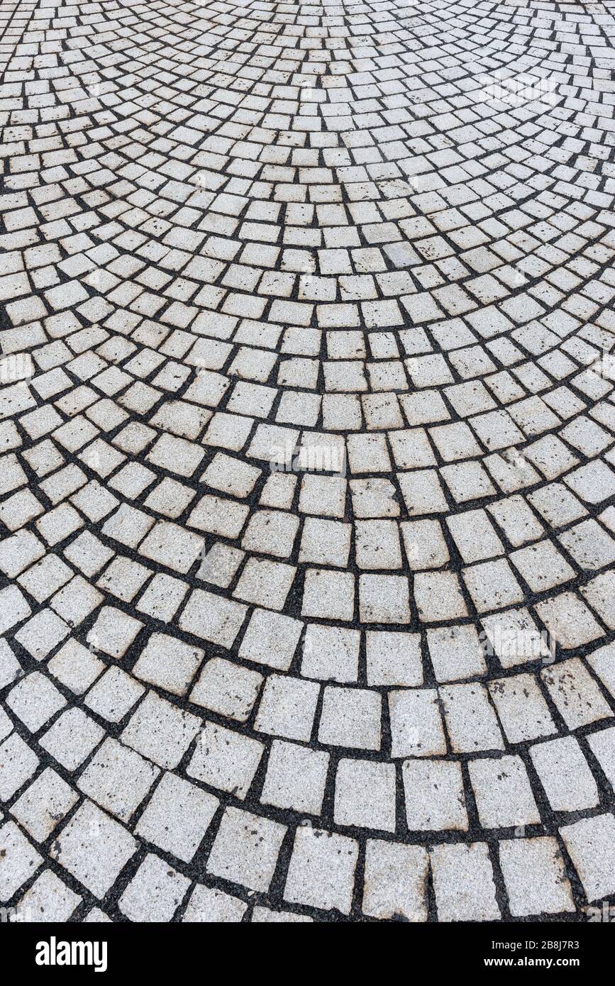 sidewalk covered with square paving stones Stock Photo